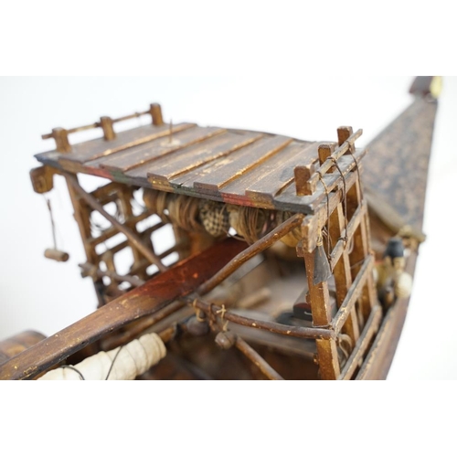 201 - Early 20th century scratch built wooden model of a Portuguese cargo boat, with painted sailor figure... 