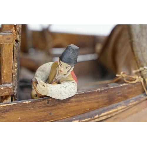 201 - Early 20th century scratch built wooden model of a Portuguese cargo boat, with painted sailor figure... 