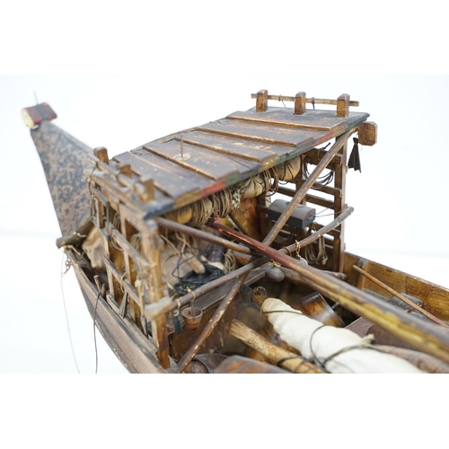 201 - Early 20th century scratch built wooden model of a Portuguese cargo boat, with painted sailor figure... 