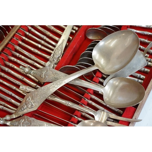 430 - Thai brass twelve-setting canteen of cutlery with handles in the form of bamboo, the servers with ca... 