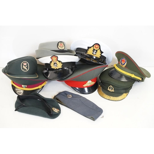 A collection of ten military caps and berets together with associated ...