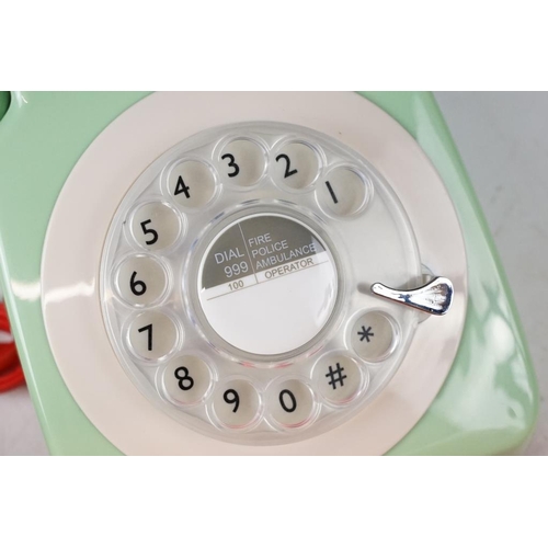 440 - Three retro style plastic rotary telephones (in red, orange & green), plus a 'Classic Phone ' antiqu... 