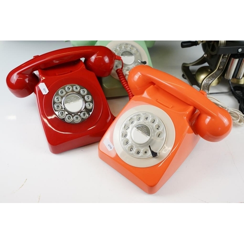 440 - Three retro style plastic rotary telephones (in red, orange & green), plus a 'Classic Phone ' antiqu... 