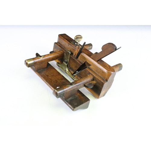 205 - Two vintage wooden planes with brass details, to include a plough plane and a screw-stem example. Wi... 