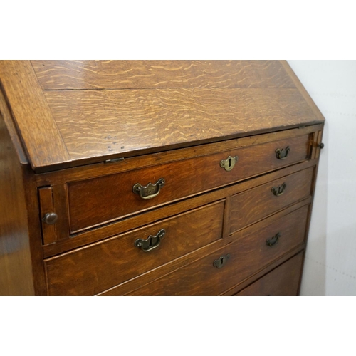 495 - George III Oak Bureau, the fall front opening to a fitted interior, over two short and three long dr... 