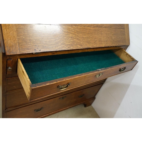 495 - George III Oak Bureau, the fall front opening to a fitted interior, over two short and three long dr... 