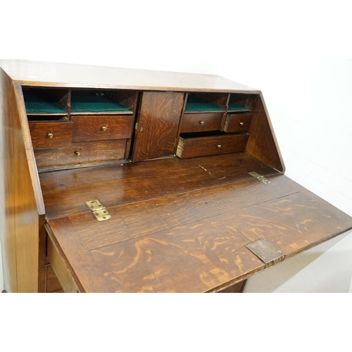 495 - George III Oak Bureau, the fall front opening to a fitted interior, over two short and three long dr... 