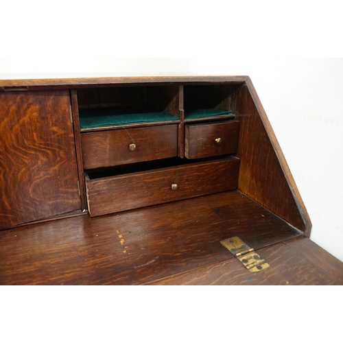 495 - George III Oak Bureau, the fall front opening to a fitted interior, over two short and three long dr... 