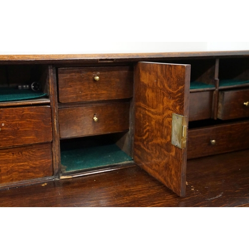 495 - George III Oak Bureau, the fall front opening to a fitted interior, over two short and three long dr... 