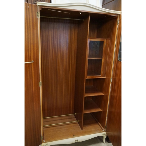 535 - Mid century French style Cream Wardrobe, the two panel doors with applied scroll decoration and hand... 