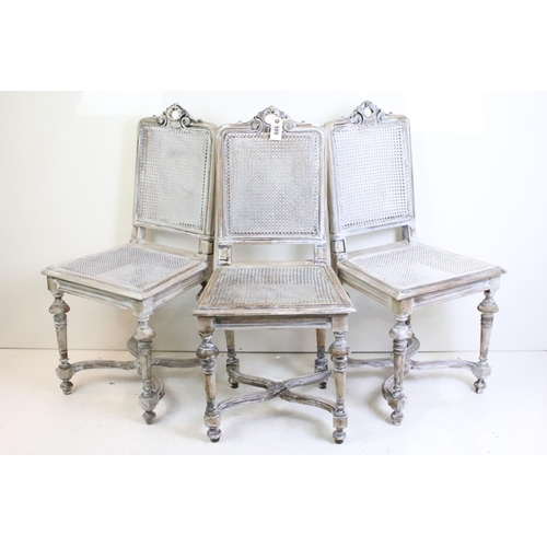 499 - Set of Four Italian style Distressed Painted Dining Room Chairs with cane back panels and seats, car... 