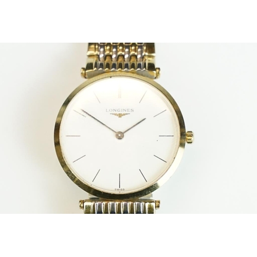 220 - A gents Le Grande Classic De Longines with white enamel dial on original bi metal strap, longings lo... 