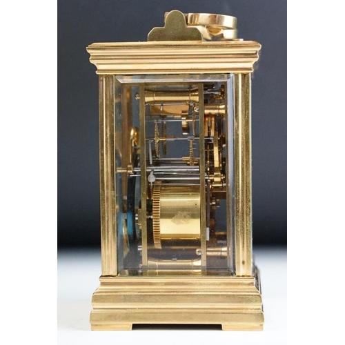 232 - A brass cased carriage clock with bevelled glass panels, with hourly repeater button to the top. App... 