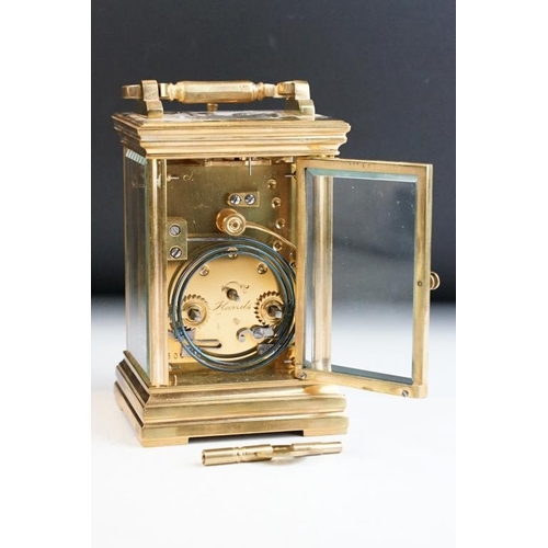 232 - A brass cased carriage clock with bevelled glass panels, with hourly repeater button to the top. App... 