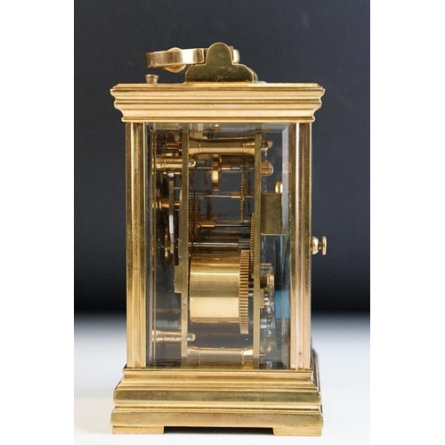 232 - A brass cased carriage clock with bevelled glass panels, with hourly repeater button to the top. App... 