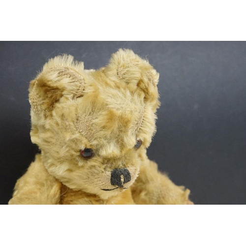 315 - Two early to mid 20th century teddy bears, one being golden mohair and the larger with straw filled ... 