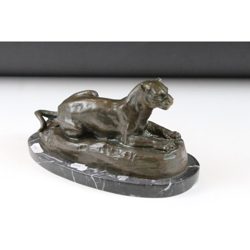 119 - After Antoine-Louis Barye (French, 1795-1875) - A bronze figure of a recumbent panther, raised on a ... 