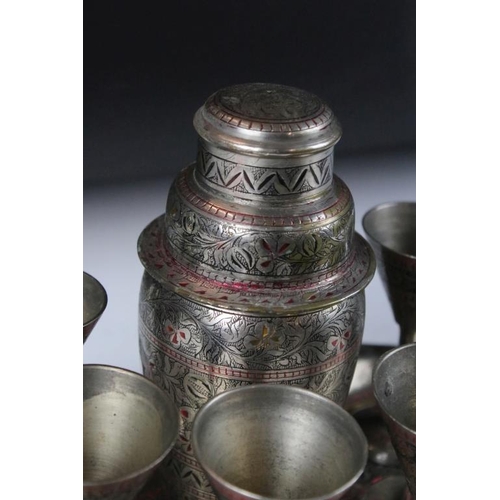 120 - Eastern silver plated cocktail set with shaker, 6 drinking vessels and tray with floral decoration. ... 