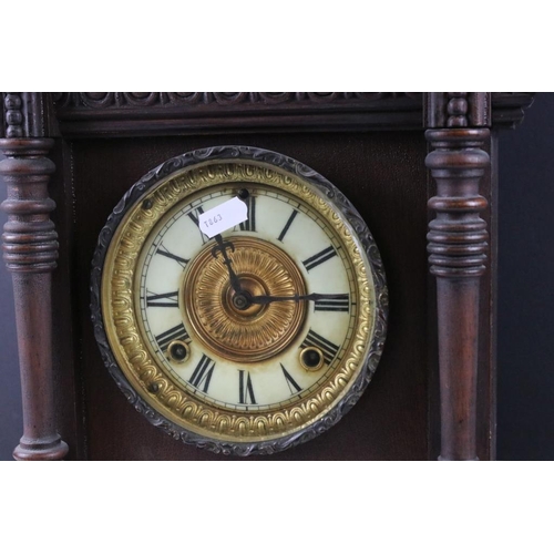 121 - Early 20th century carved wooden chiming mantle clock, with cream dial, Roman numerals & Ansonia Clo... 