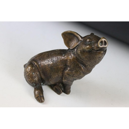 124 - Bronze figure of a seated pig, approx 14.5cm high