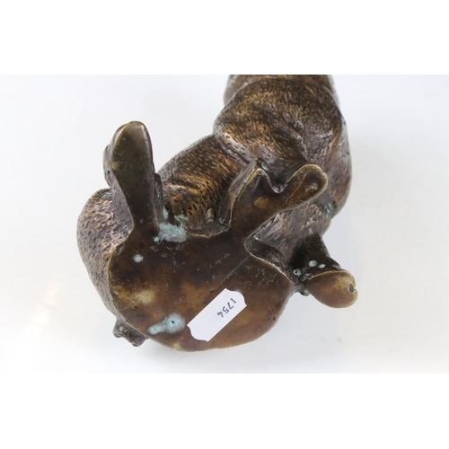 124 - Bronze figure of a seated pig, approx 14.5cm high