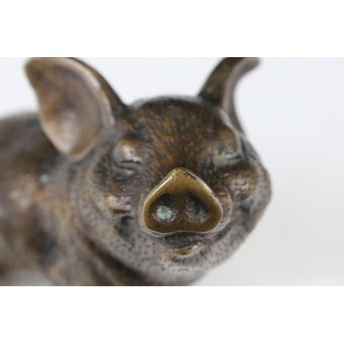 124 - Bronze figure of a seated pig, approx 14.5cm high