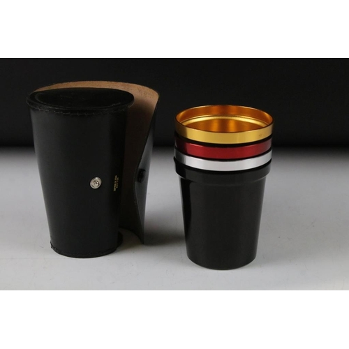 129 - Harlequin set of Four Stacking Metal Stirrup Cups contained in a black real hide leather case, 13cm ... 