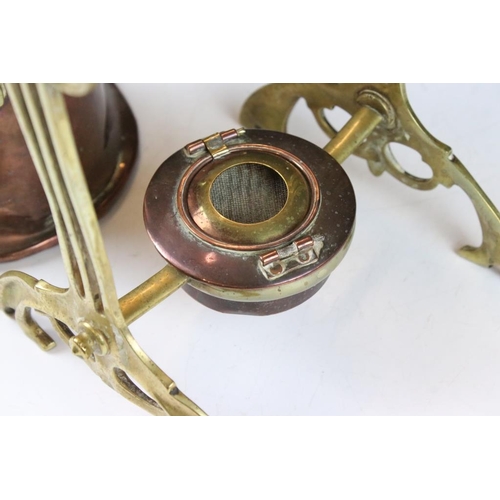 131 - Art Noveau copper spirit kettle, raised on a brass stand, with burner, approx 36cm high