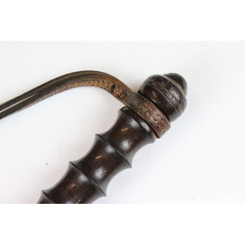 133 - Early 20th century turned wooden truncheon, with ribbed grip and leather strap, approx 38cm long