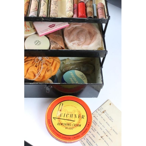 137 - 1960's stage makeup set, housed within a cantilever tin box, mirror to lid interior. Measures approx... 