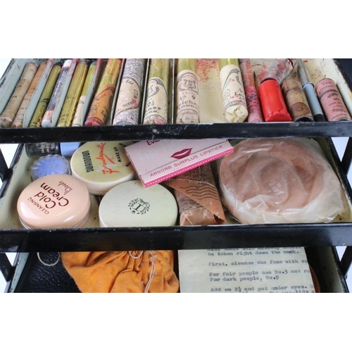 137 - 1960's stage makeup set, housed within a cantilever tin box, mirror to lid interior. Measures approx... 