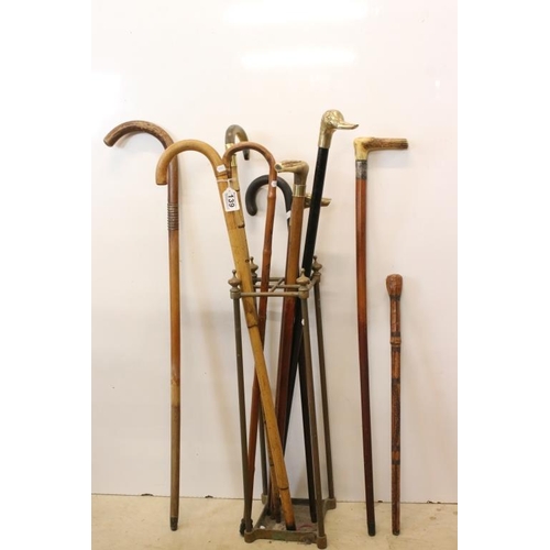 139 - Collection of nine wooden walking sticks, 19th century onwards, featuring a late 19th century horn-h... 