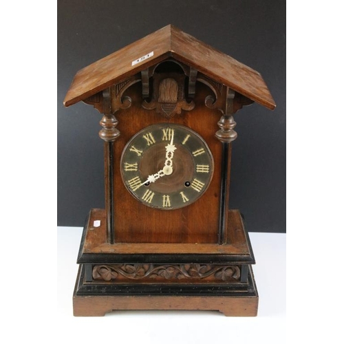 151 - Late 19th / early 20th century Black Forest carved oak mantle cuckoo clock, the circular dial with R... 