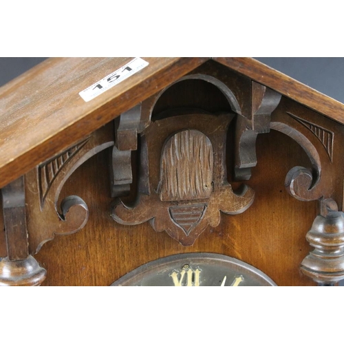 151 - Late 19th / early 20th century Black Forest carved oak mantle cuckoo clock, the circular dial with R... 