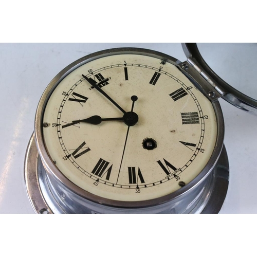 156 - Chrome bulkhead nautical ships clock, the cream dial with black Roman numerals and poker style hands... 