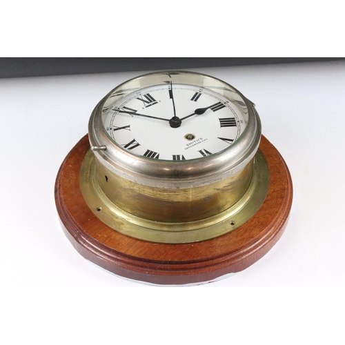 157 - Smiths brass bulkhead ships clock, the white enamel dial with Roman numerals and poker style hands, ... 