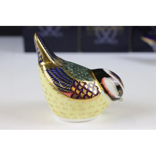 16 - Four Royal Crown Derby gold stopper paperweights to include a large owl, bluetit, chaffinch and nuth... 