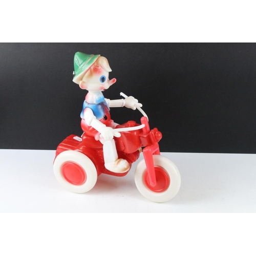 164 - Vintage Russian Pinocchio trike plastic push-along toy, approx 30cm high