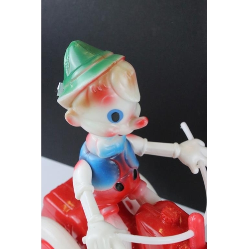 164 - Vintage Russian Pinocchio trike plastic push-along toy, approx 30cm high