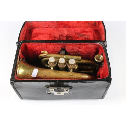 169 - Brass piccolo / pocket cornet with mother of pearl keys, cased