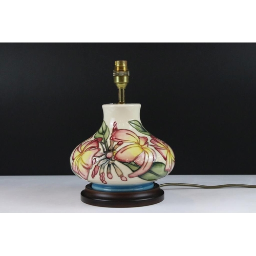 19 - Moorcroft ceramic lamp base in the frangipani pattern having tube lined yellow and pink flowers. Sti... 