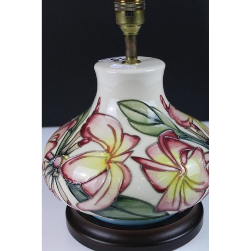 19 - Moorcroft ceramic lamp base in the frangipani pattern having tube lined yellow and pink flowers. Sti... 