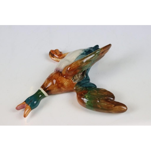 20 - Set of three Beswick ceramic flying duck wall plaques, each having hand painted details. Marked 596-... 