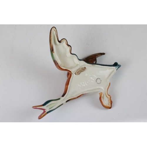 20 - Set of three Beswick ceramic flying duck wall plaques, each having hand painted details. Marked 596-... 