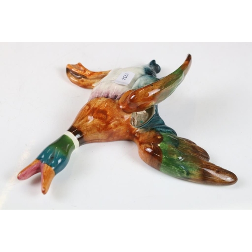 20 - Set of three Beswick ceramic flying duck wall plaques, each having hand painted details. Marked 596-... 