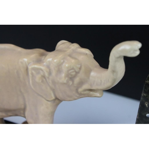 24 - Art Deco Ceramic Clock Holder, the slate base surmounted by an Elephant, 44cm long x 22cm high