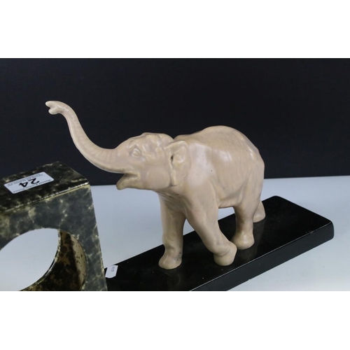 24 - Art Deco Ceramic Clock Holder, the slate base surmounted by an Elephant, 44cm long x 22cm high