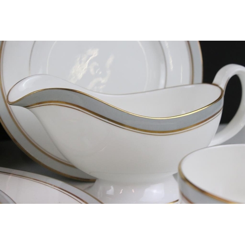 25 - Royal Worcester Howard pattern dinner service having grey and gilt rims. The lot to include two grav... 