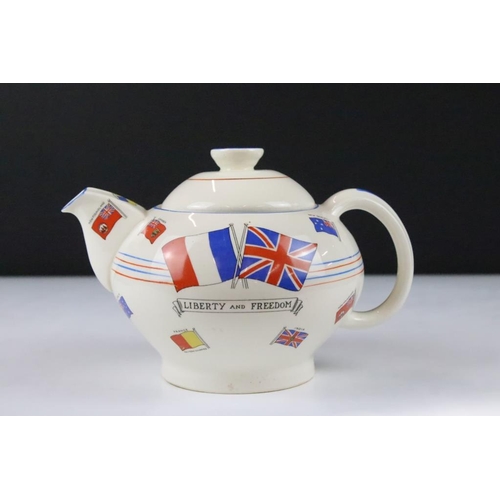 3 - Crown Ducal WWII second world war commemorative teapot. The teapot decorated with flags and a centra... 