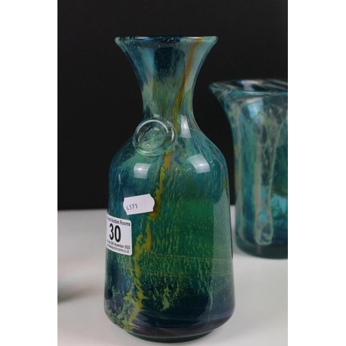 30 - Four Mdina glass vases to include crystal blue stripe pattern vases, and two in the blue summer patt... 